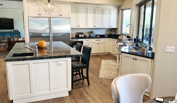 large island with white cabinets